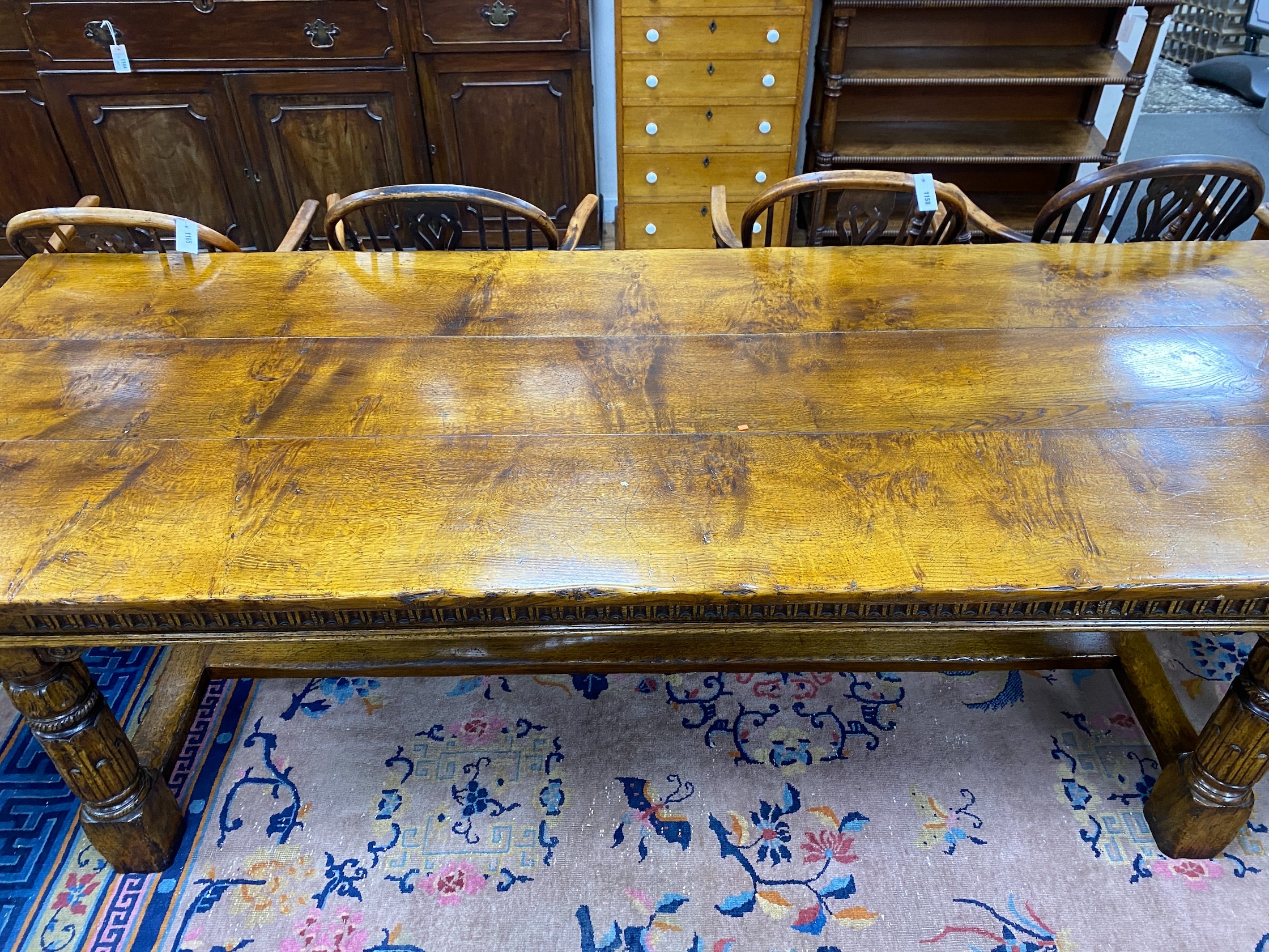 An 18th century style rectangular pale oak refectory dining table with central stretcher and two detachable extending leaves, (lacking three bolts) length 244cm, width 91cm, height 75cm, extending leaves each 46cm